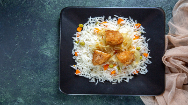 _2024-02-15_11_47_top-view-tasty-boiled-rice-with-beans-meat-inside-plate-dark-desk.jpg